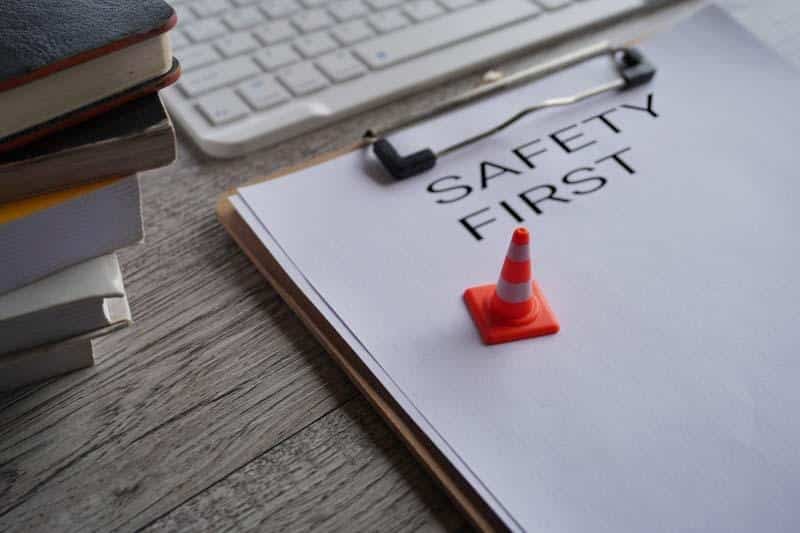 An image of a clipboard with a mini safety cone shows in this file photo. Learn how to better document safety concerns using the 1st Reporting application.