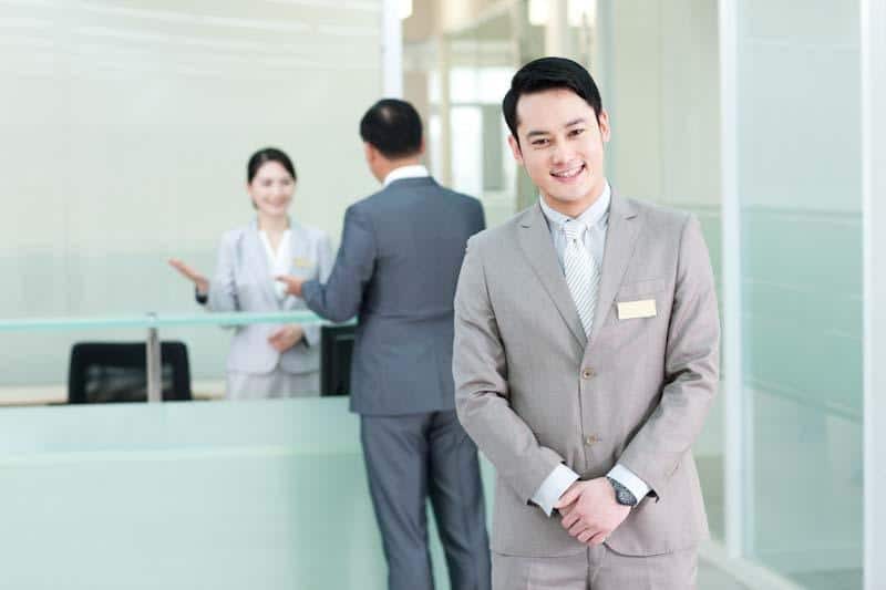 A guest services manager happily smiles at the camera knowing he has a great way of enhancing guest experiences, even in the case of a work incident. Learn more at 1stReporting.com.