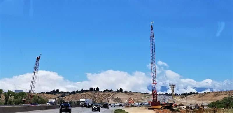 A busy construction site along a highway reveals the importance for proper communication and data management in field operations. Learn more at 1stReporting.com.