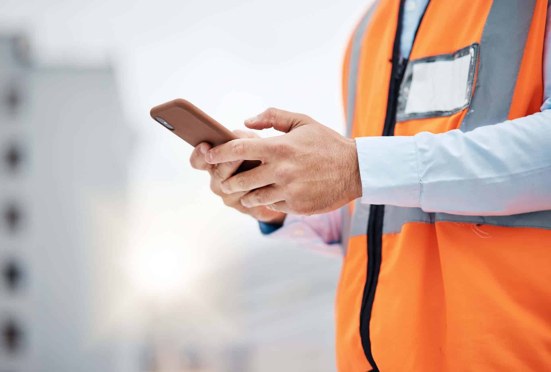 A safety officer types into the 1st Reporting app on a Risk Management and Hazard Awareness form. Learn more about mobile risk management at 1stReporting.com.